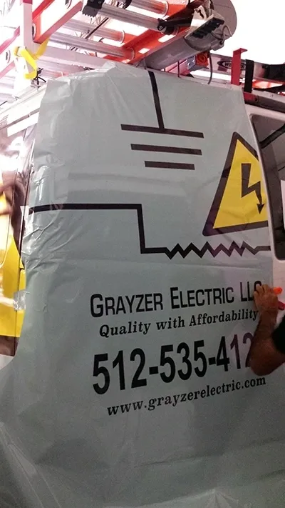 Grayzer Electric van getting wrapped to get ready for more charging station installations.